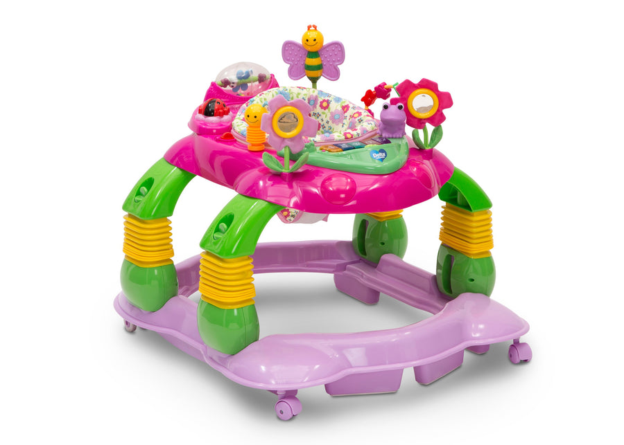 A colorful plastic baby walker toy with a pink top, green and yellow legs, and a purple base, featuring attached toy flowers, a bee, and a patterned activity mat on a white background. 19-Lil’ Play Station 4-in-1 Activity Walker