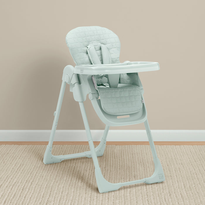 Light gray high chair on a beige carpet with a beige wall background 0-babyGap Classic 3-in-1 Convertible High Chair for Babies & Toddlers