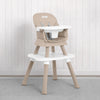 A beige and white Jeep high chair with a matching footrest, set against a white paneled wall and gray carpet. 60-Milestone 6-in-1 High Chair