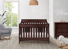 Nursery room with a wooden crib, gray chair, and dresser. 21-Bentley 'S' Series 4-in-1 Crib