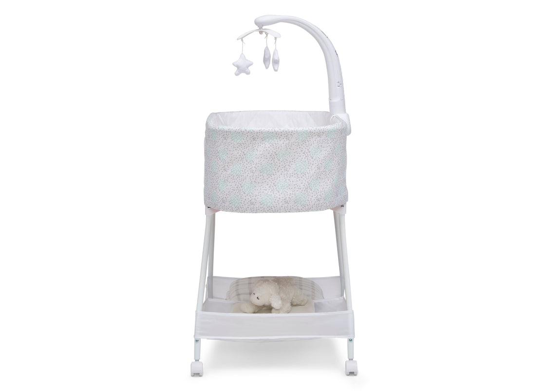 Baby bassinet with stand and hanging mobile on a white background