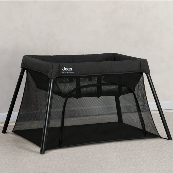 Black Jeep travel cot on a light gray background 0-Horizon Compact Travel 2-in-1 Play Yard and Bassinet
