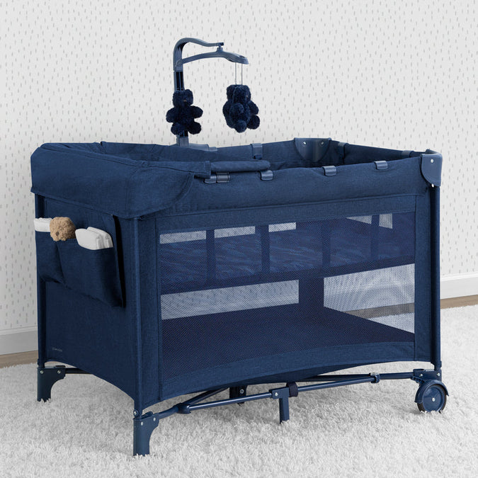 Navy blue baby crib with mobile on a white background 8-babyGap Deluxe Play Yard