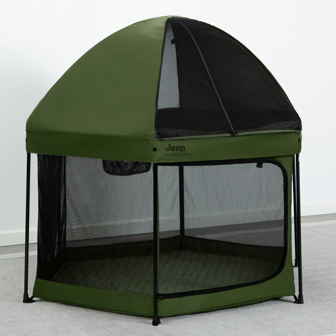 A green hexagon-shaped pop-up play yard with a removable canopy and mesh netting on the sides.