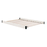 Wooden bed frame with metal slats on a white background