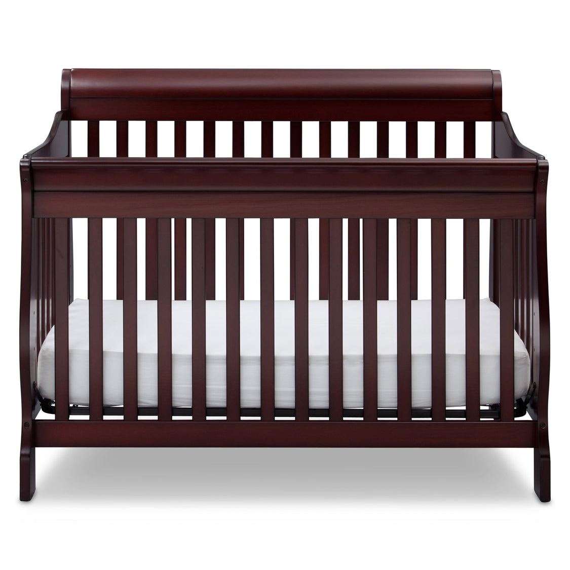 Wooden crib with white mattress on a white background