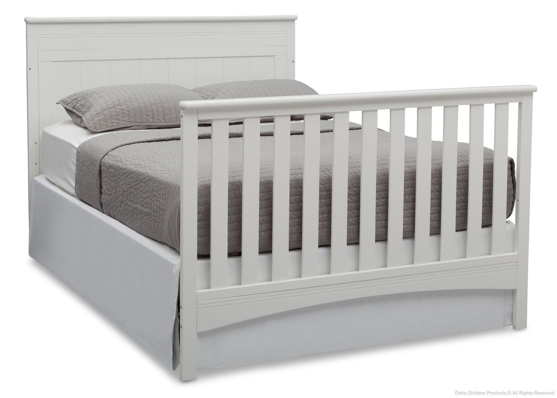 White crib with gray bedding on a white background