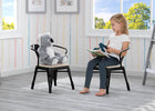 Child reading a book to a plush koala toy on a chair in a bright room with large windows. 35-Bistro 2-Piece Chair Set