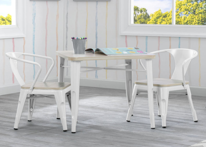White dining table with chairs on a wooden deck