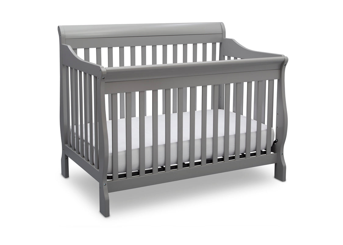 Gray crib with white mattress on a white background