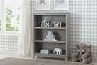 Gray bookshelf with decorative items in a room with checkered wallpaper and a window. 19-Epic Bookcase