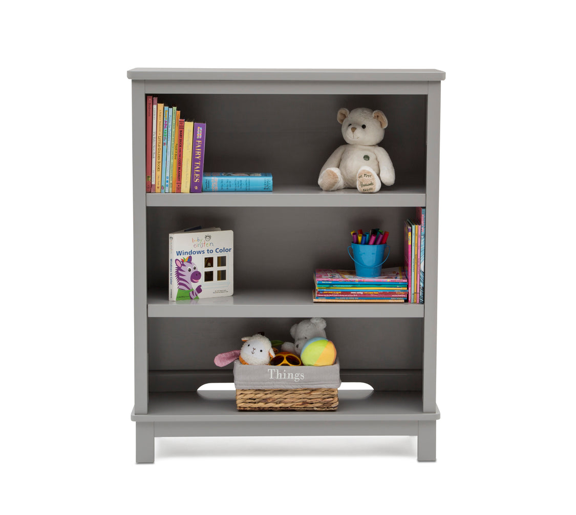 Gray bookshelf with books, toys, and a teddy bear on a white background