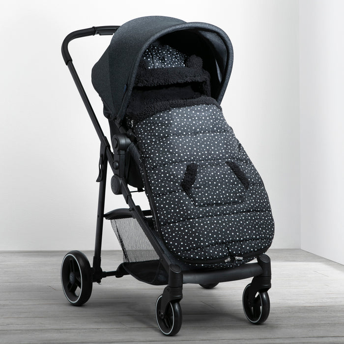 A black babyGap toddler stroller footmuff attached to a stroller, featuring a hood with bear ears and a dotted pattern. 2-babyGap Toddler Stroller Footmuff