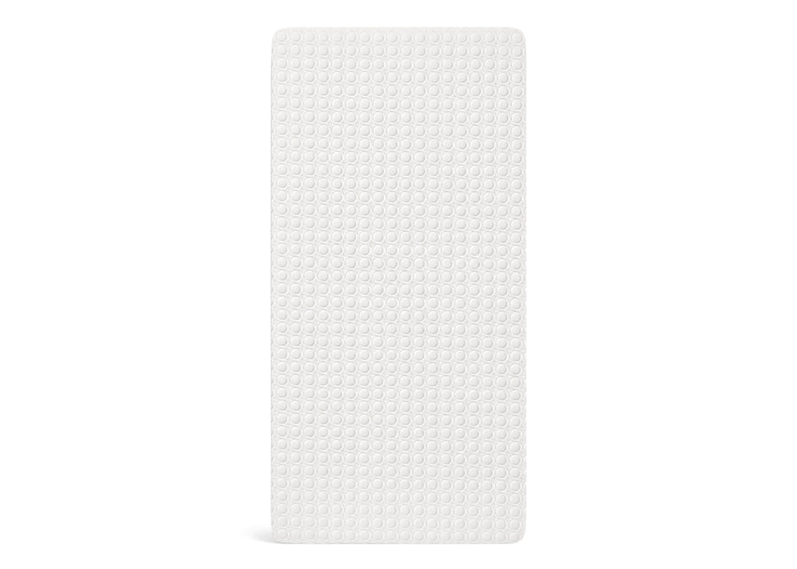 A white textured rectangular mat with a uniform raised circular pattern, shown against a plain white background. 10-Eco-Cool Cooling Crib Mattress Protector