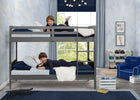 Children playing on a bunk bed in a room with a window, chair, and books. 13-Convertible Twin Bunk Bed with Ladder and Guardrails