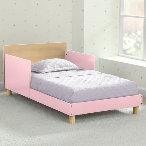 Pink and wooden bed in a room with light-colored walls and a window.