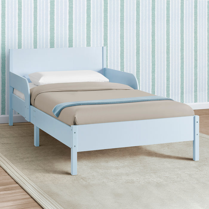 White bed with blue accents against a striped wall 3-Cora Wood Twin Bed with Removable Guardrails