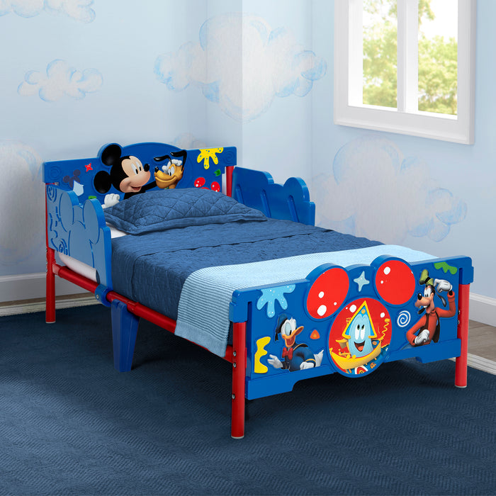 Children's bed with cartoon character design in a room with blue walls and a window. 1-Mickey Mouse 3D Toddler Bed