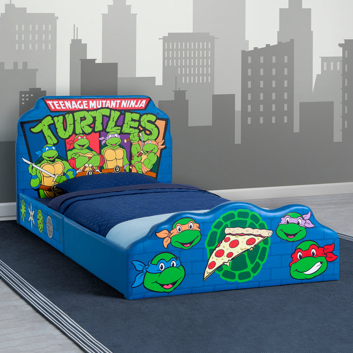 Children's bed with Teenage Mutant Ninja Turtles design against a cityscape background 1-Teenage Mutant Ninja Turtles Upholstered Twin Bed