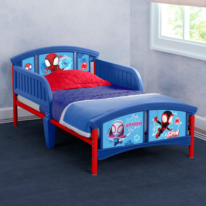 Children's bed with Spider-Man design in a room with a window. 0-Spidey and His Amazing Friends Plastic Toddler Bed
