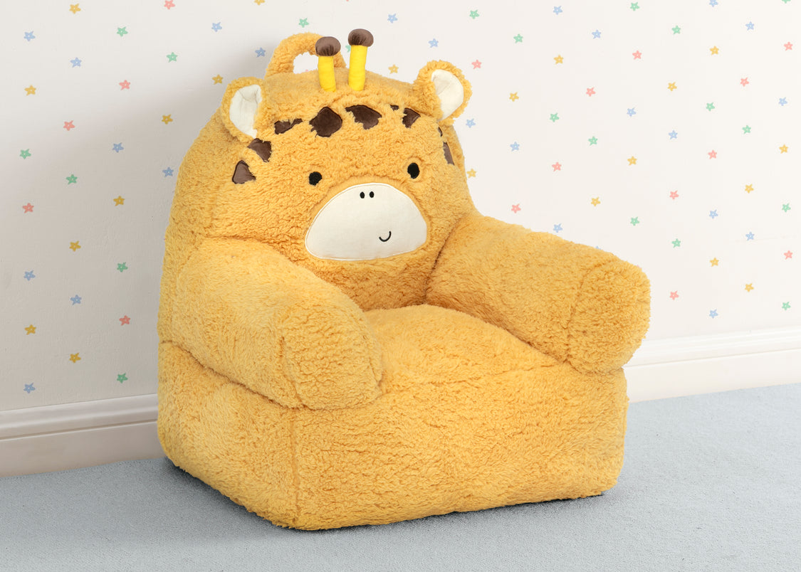 Yellow teddy bear-shaped bean bag chair against a polka dot wall.