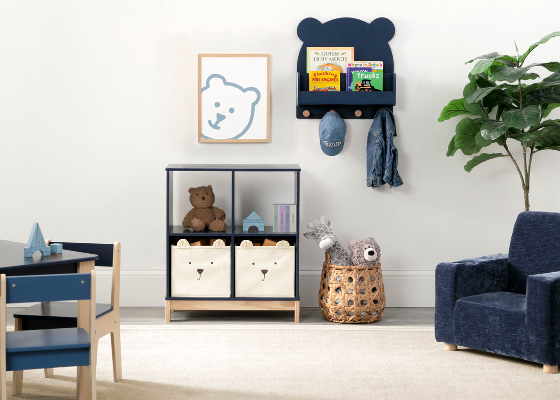 Children's room with blue chair, toy storage unit, and decorative items.
