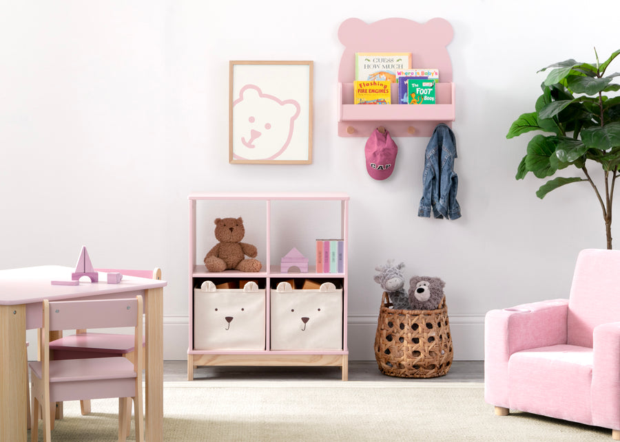 Children's room with pink chair, storage bins, and toys. 42-Brannan Bear Bookcase with Bins