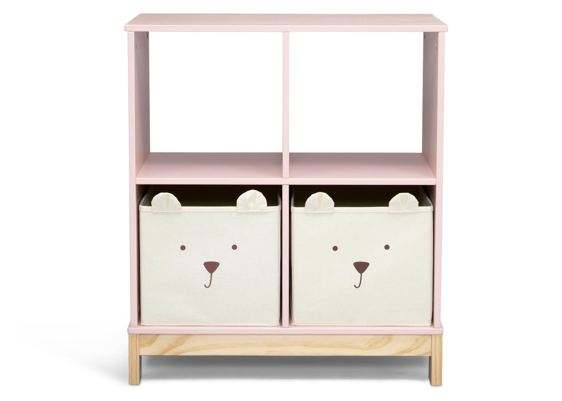 Pink children's bookshelf with bear face storage bins on a white background