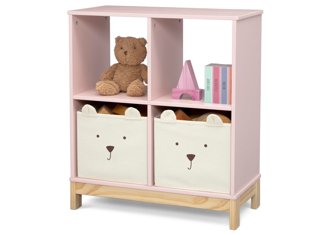 Pink children's bookshelf with teddy bear and storage bins on a white background