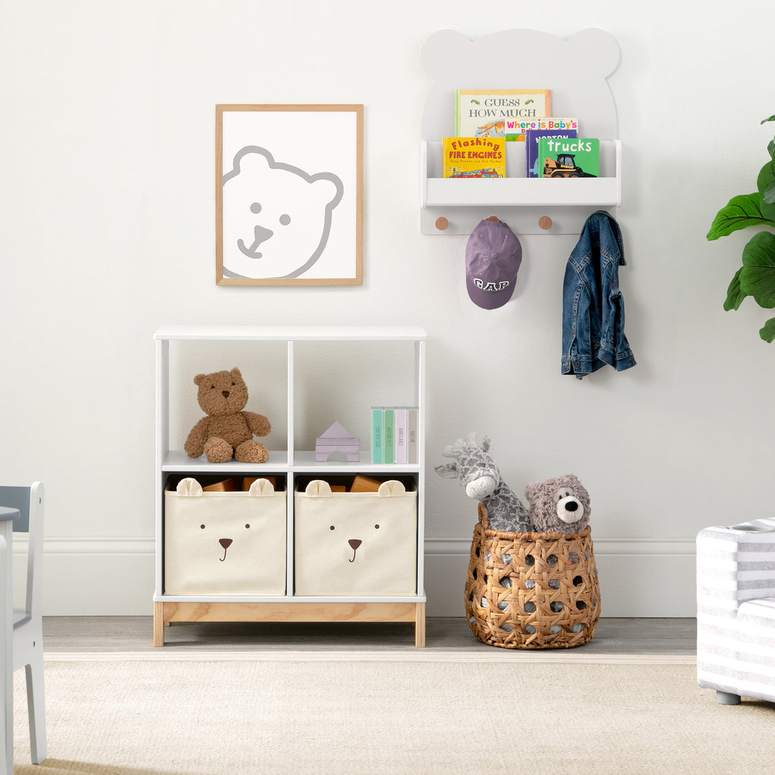 Children's room with storage units, toys, and wall art in a neutral color scheme.