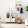 Children's room with storage units, toys, and wall art in a neutral color scheme. 36-Brannan Bear Bookcase with Bins