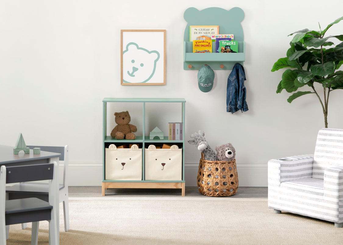 Children's room with a bookshelf, teddy bear, and decorative items.