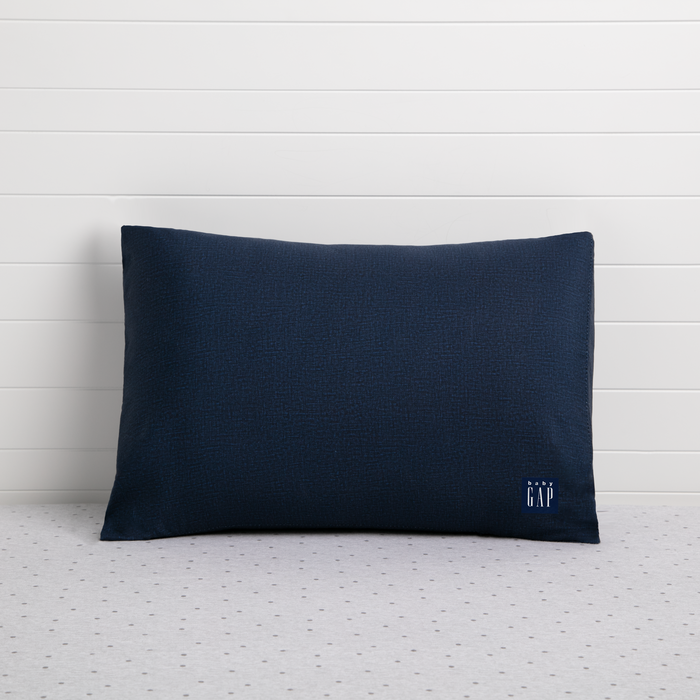 A navy-colored toddler pillow with a small logo on the bottom right corner, presented against a white background. 2-babyGap Memory Foam Toddler Pillow with 2 Cooling Covers