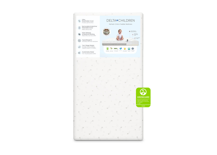 Delta Children crib mattress on a white background with a green label. 27-Refresh 2-Stage Crib and Toddler Mattress