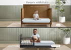 Two-stage baby bed with toddler bed conversion, showing a child sitting on each stage. 37-Refresh 2-Stage Crib and Toddler Mattress