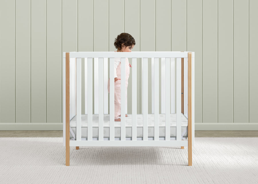 White crib with wooden frame in a minimalistic room 15-Twinkle Galaxy 3-inch Mini/Portable Crib Mattress
