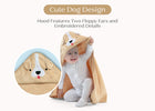 Child wearing a dog-themed hooded towel with floppy ears and embroidered details on a white background. 34-Baby Hooded Bath Towel
