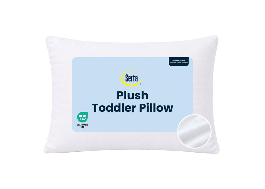 A white Serta Plush Toddler Pillow with a light blue front label showing the brand name and product details, set against a plain white background. 24-Serta Plush Comfort Toddler Pillow