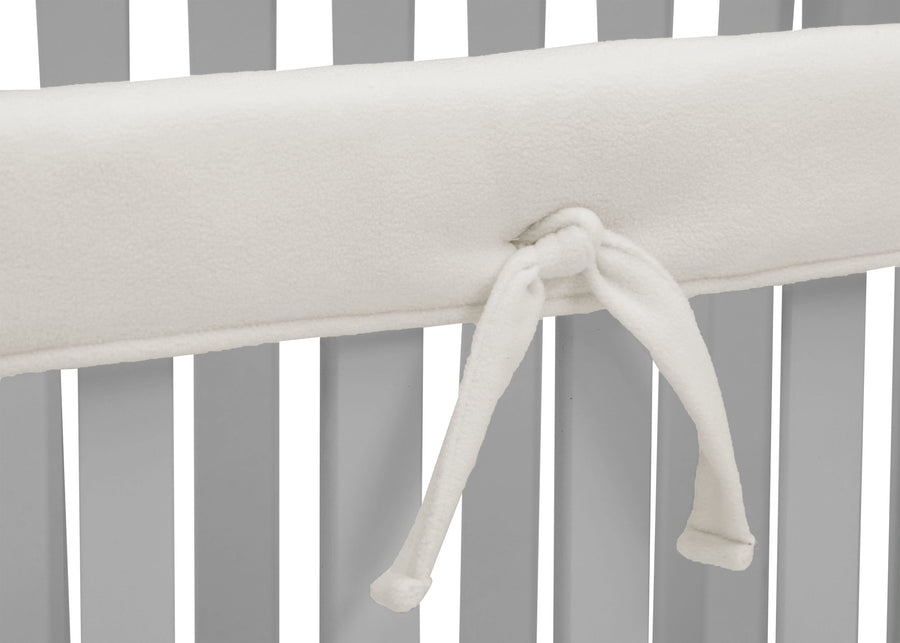 Delta Children Ivory (124) Waterproof Fleece Crib Rail Covers/Protectors for Short Side Rails, 2 Pack, Tie Detail View 10-Waterproof Fleece Crib Rail Covers/Protectors for Short Side Rails, 2 Pack