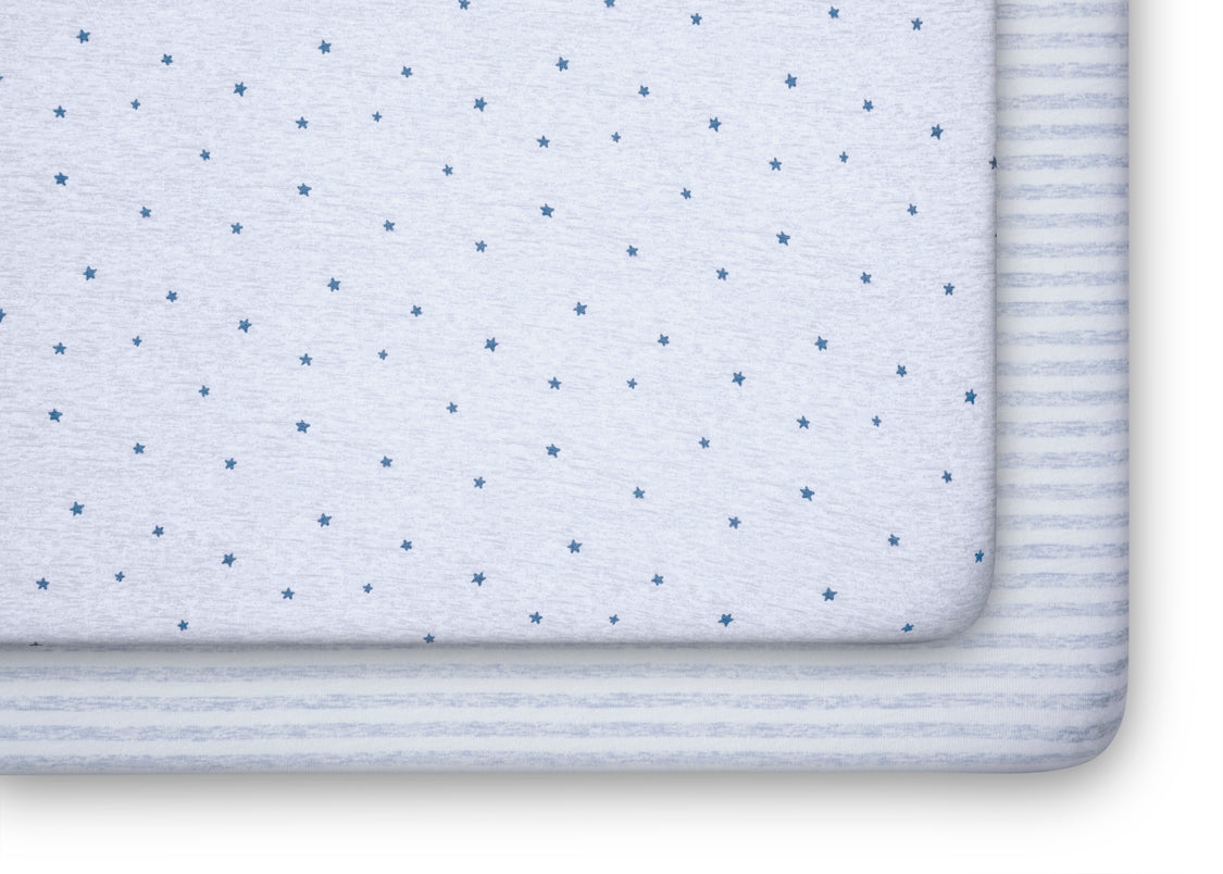 Close-up of a folded fabric with a subtle pattern on a white background