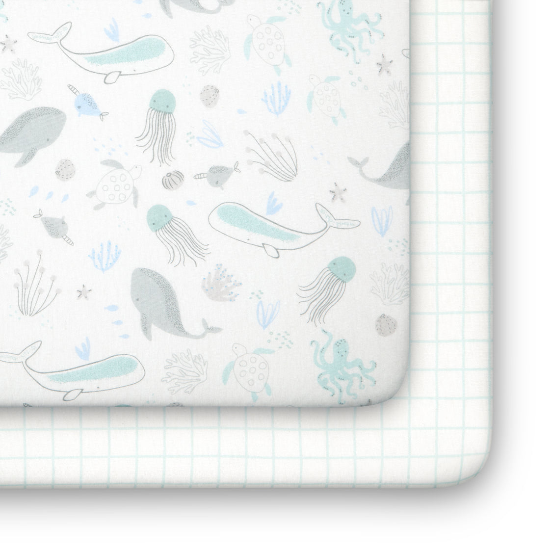 Sheet with whale and jellyfish pattern on a grid background