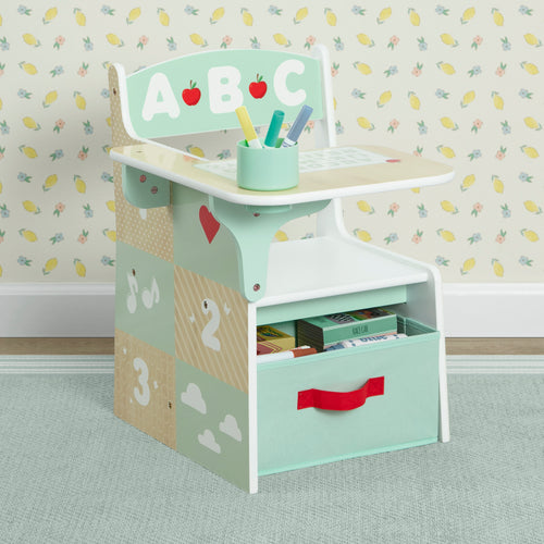 Children's学习桌 with storage drawers against a patterned wall.