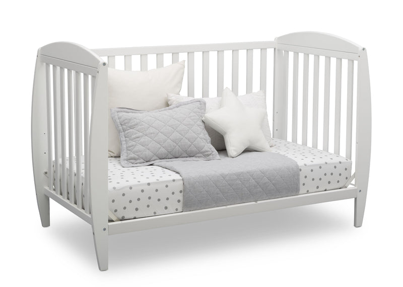 White crib with bedding and pillows on a white background 18-Taylor 4-in-1 Convertible Crib