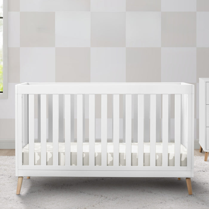 White crib in a room with striped wallpaper 0-Essex 4-in-1 Convertible Crib