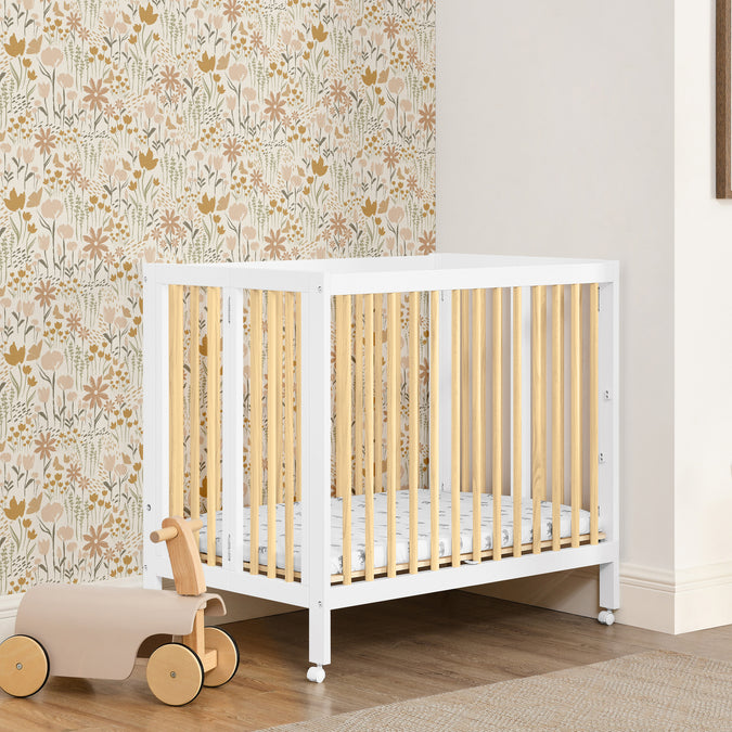 W105550 123 Mia Portable Mini Crib Bianca White wNatural Lifestyle 111 50-Mia Portable Folding Mini Crib with 1.5-Inch Mattress