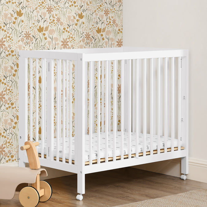 W105550 130 Mia Portable Mini Crib Bianca White Lifestyle 111 31-Mia Portable Folding Mini Crib with 1.5-Inch Mattress