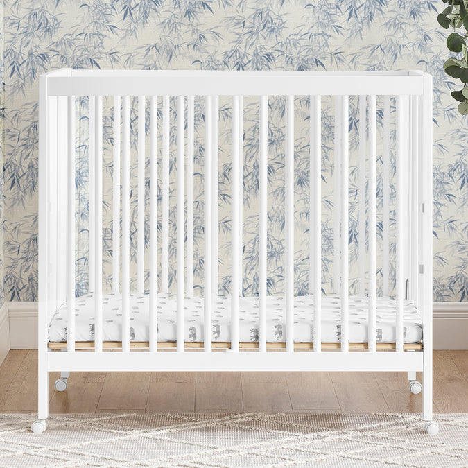 W105550 130 Mia Portable Mini Crib Bianca White Lifestyle 117 32-Mia Portable Folding Mini Crib with 1.5-Inch Mattress