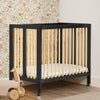 W105550 1482 Mia Portable Mini Crib Black wNatural Lifestyle 111 49-Mia Portable Folding Mini Crib with 1.5-Inch Mattress