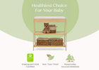 Baby changing table with teddy bear and basket on a green background, emphasizing health and safety. 70-Scout Changing Table