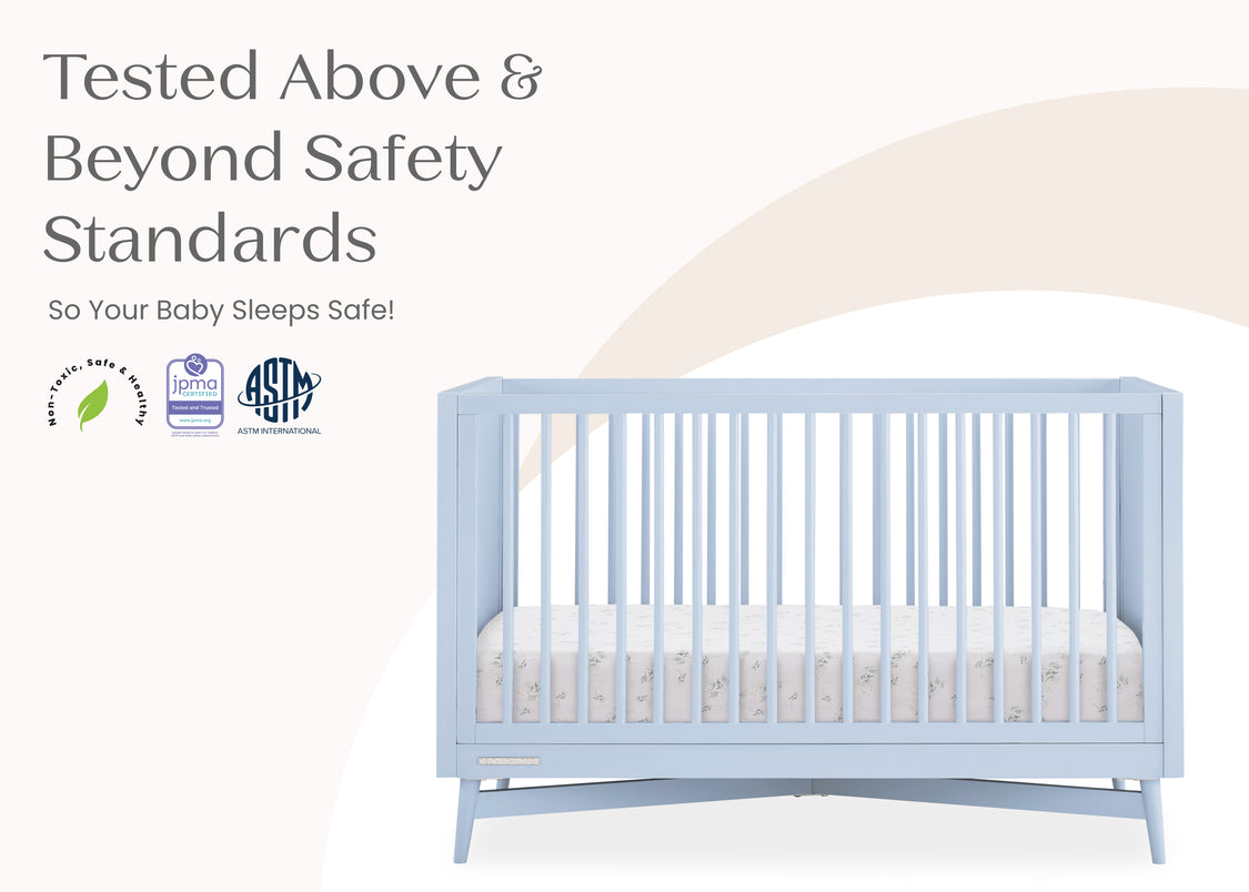 Blue crib with safety certification logos on a white background